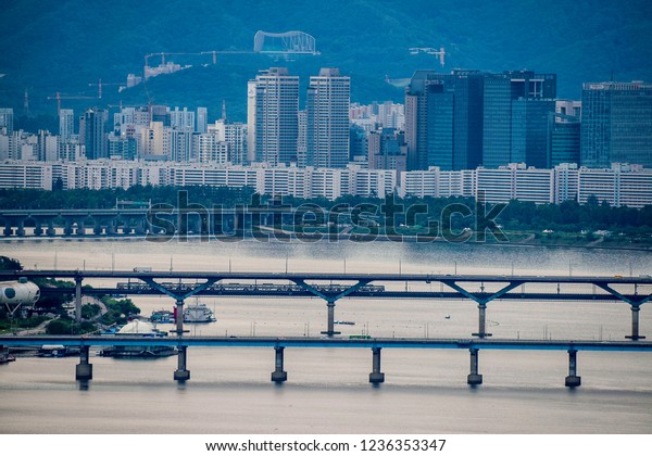 Seoul City,morning light\
Subway train traffic and car driving on the bridge highway in\
Seoul,Korean