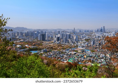 Seoul cityscape in South Korea. City landscape of Jung district (Jung-gu) and Mapo district (Mapo-gu), with Huam-dong neighborhood. Namsan Park in foreground.