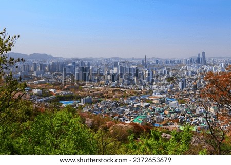 Seoul cityscape in South Korea. City landscape of Jung district (Jung-gu) and Mapo district (Mapo-gu), with Huam-dong neighborhood. Namsan Park in foreground.