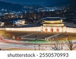 Seoul, Gwanghwamun Gate at night (translation: the frame at the gate reads "Gwanghwamun")