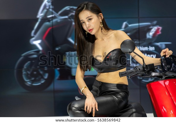 Seoul, Korea - April 2,\
2019: Seoul Motor Show 2019 was held at KINTEX. A model is posing\
on a motorcycle.