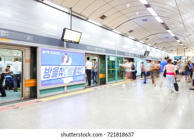 SEOUL, KOREA - AUGUST 12, 2015: People taking subway train after rush hour - Seoul, South Korea