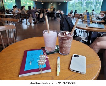 Seoul, Korea - Jun 26 2022: Drink ice cold summer drink from Starbucks Korea. Spending weekend dating at a cafe.