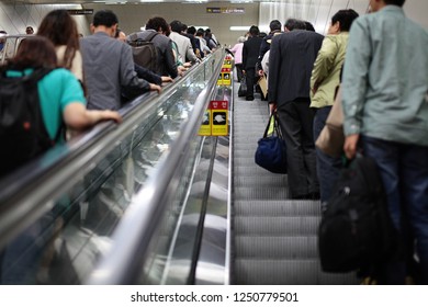 SEOUL, KOREA - MAY 2, 2012: View of passengers using underground escalator in Seoul subway station.