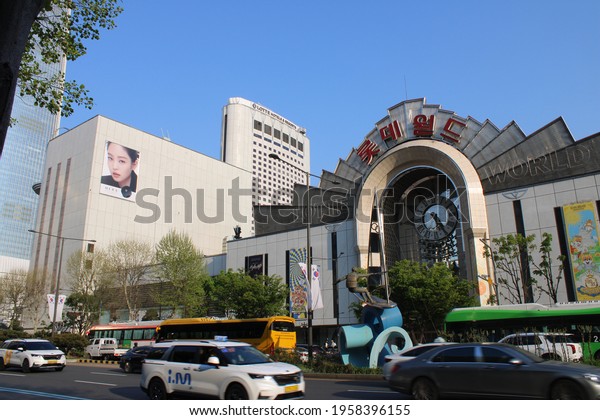Seoul,\
Korea-April 19, 2021: Street view of Lotte World Mall and Resort,\
with busy late afternoon traffic, in Jamsil,\
Seoul