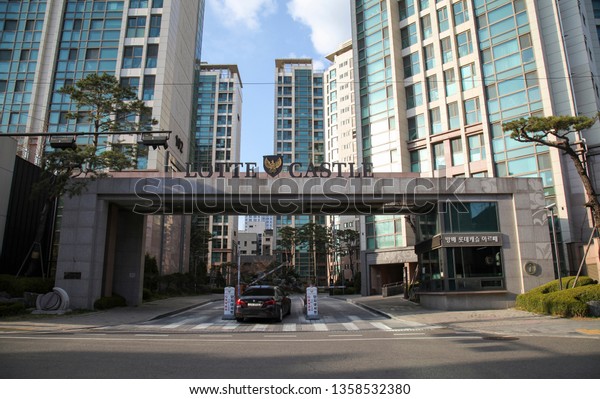 Seoul, South Korea -\
April 2 2019: Black Car Passing the Entrance to Lotte Castle\
Apartment Complexes.  Lotte Castle is One of the Most Prefered\
Apartment in South Korea.\
