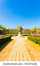 Seoul, South Korea - April 21, 2015: Path Leading To Horace Grant Underwood Statue Surrounded By Ivy Covered Buildings On Main Quad Of Sinchon Campus Of Yonsei University