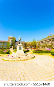 Seoul, South Korea - April 21, 2015: Ivy Covered Brick Buildings Surround The Quad With Horace Grant Underwood Statue At Venerable Yonsei University In Sinchon, Republic Of Korea. Vertical