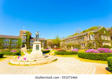 Seoul, South Korea - April 21, 2015: Ivy Covered Brick Buildings Surround The Quad With Horace Grant Underwood Statue At Venerable Yonsei University In Sinchon, Republic Of Korea. Horizontal