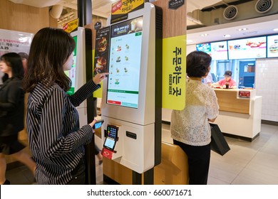 SEOUL, SOUTH KOREA - CIRCA MAY, 2017: Woman Use McDonald's Ordering Kiosk. McDonald's Is An American Hamburger And Fast Food Restaurant Chain.