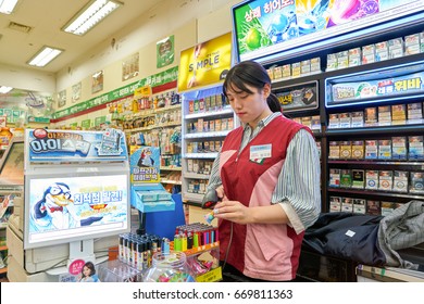 SEOUL, SOUTH KOREA - CIRCA MAY, 2017: Worker At 7-Eleven Convenience Store. 7-Eleven Is An International Chain Of Convenience Stores.