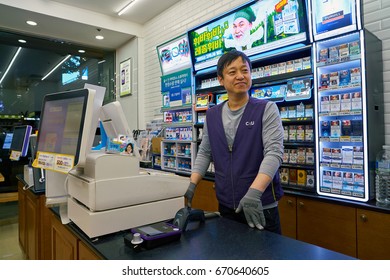 SEOUL, SOUTH KOREA - CIRCA MAY, 2017: Worker At CU Convenience Store. CU Is A Convenience Store Franchise Chain In South Korea.