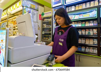 SEOUL, SOUTH KOREA - CIRCA MAY, 2017: Worker At CU Convenience Store. CU Is A Convenience Store Franchise Chain In South Korea.