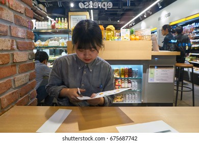 SEOUL, SOUTH KOREA - CIRCA MAY, 2017: Worker At A Convenience Store In Seoul.