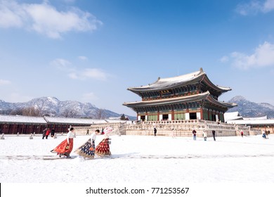 Seoul, South Korea - February, 2017: Gyeongbokgung Palace In Winter And Girls In Hanbok Clothes.