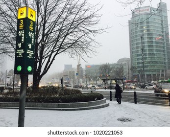 Seoul, South Korea, January 30, 2018, People are walking to the Seoul subway 2 line Samsung Station when the snow falls in the evening at the office street in Gangnam, Seoul, Korea
