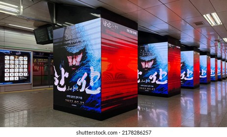 Seoul, South Korea - July 12 2022: Digital billboards on Gangnam metro station platform.