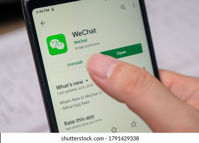 Seoul, South Korea - July 2020 : Finger Close-up To Uninstall WeChat App On A Smartphone.