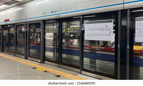 Seoul South Korea - May 22 2022: Screen door and subway train on the platform of Seoul Metro Station
