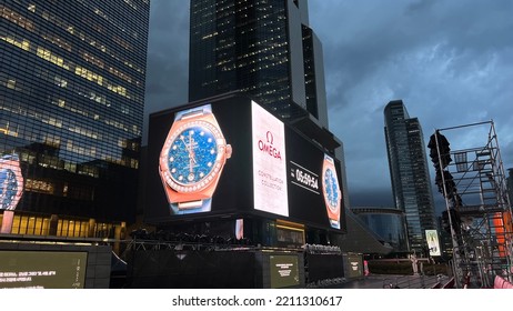 Seoul, South Korea - Oct 6 2022: OMEGA Ad On Digital Billboard At Coex Screen Square. Omega Indicates 5:59:54 PM. Cityscape At Night