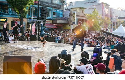 SEOUL, SOUTH KOREA - October 15, 2017:People are watching B-boy battle break dances in Itaewon, Seoul.