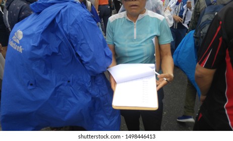 Seoul, South Korea; September 7, 2019: Volunteer Trying To Get Signatures On Petition During Demonstration Against South Korean President Moon Jae-In.