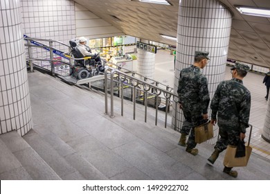 Seoul, South Korea-May 19, 2014_Disabled Passenger Use Wheelchair Step Lift Or Stair Climber In Subway Station. Wheelchair Platform Stairlift To Easily Accessible For Wheelchair Users In Subway System