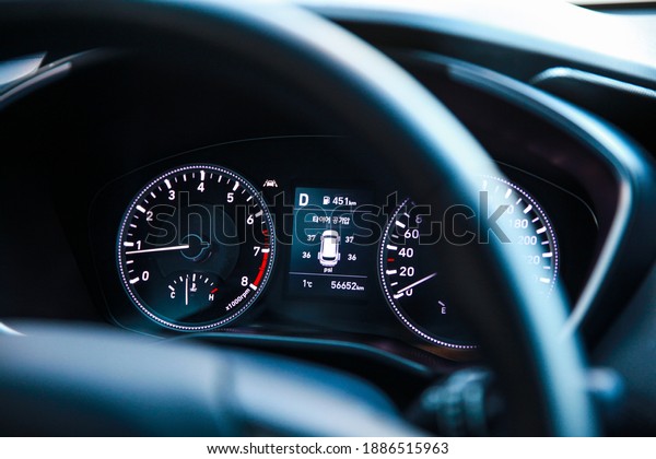 Seoul, South Korea-November 2019:\
Close up image of Korean car speedometer with tire pressure\
sign