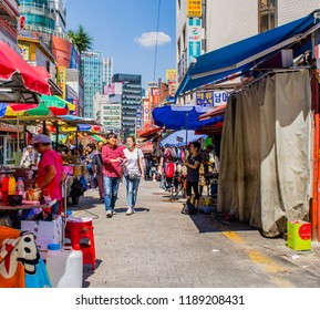 Seoul,South Korea; September 9,2018: Unidentified Asian Couple Walking Through Namdaemoon Market On Sunny Afternoon. 