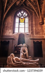 SEP 27, 2013 Bern, Switzerland - Virgin Mary And Jesus Christ Marble Statue In Evangelical Church Gothic Architecture With Light Through Stainglass Window