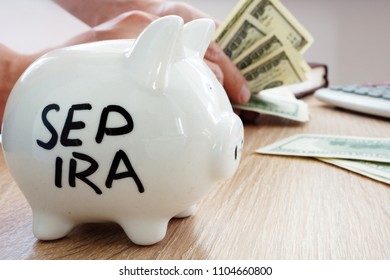 SEP IRA Written On A Side Of Piggy Bank. Pension Plan.