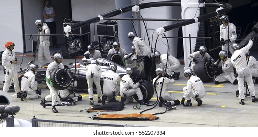 SEPANG, MALAYSIA, 30 March 2014: McLaren Mercedes entering crews does pit-stop at the 2014, F1 Petronas Malaysian Grand Prix at Sepang International Circuit.