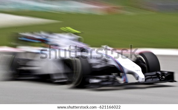 SEPANG, MALAYSIA, 30 March 2014: Motion Blur,\
Williams Martini Racing F1 team driver, Valtteri Bottas, perform of\
2014 FORMULA 1, Petronas Malaysia Grand Prix at Sepang\
International Circuit.