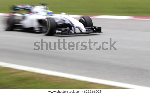 SEPANG, MALAYSIA, 30 March 2014: Motion Blur,\
Williams Martini Racing F1 team driver, Valtteri Bottas, perform of\
2014 FORMULA 1, Petronas Malaysia Grand Prix at Sepang\
International Circuit.