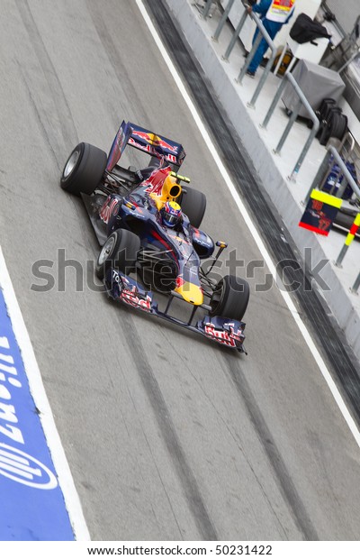 SEPANG, MALAYSIA -
APRIL 4: Australian Mark Webber of Team Red Bull exiting the pit
lane after a tyre change at the Petronas Formula 1 Grand Prix April
4, 2010 in Sepang,
Malaysia