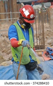 SEPANG, MALAYSIA - JULY 18,  2015: Construction Workers Spraying The Anti Termite Chemical Treatment To The Pile Cap At The Construction Site.