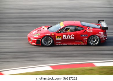 SEPANG, MALAYSIA - JUNE 20 : LMP Ferrari Car 27 At Turn 15, Super GT Car Race On June 20, 2010 In Sepang Circuit, Malaysia.