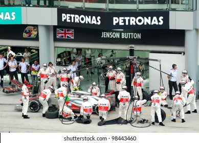 SEPANG, MALAYSIA - MARCH 25: McLaren Mercedes Team crews does pit-stop practice at the 2012 F1 Petronas Malaysian Grand Prix at Sepang International Circuit on March 25, 2012 in Sepang, Malaysia