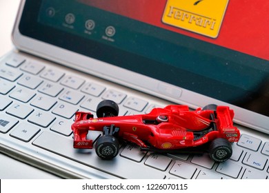 SEPANG, MALAYSIA - NOVEMBER 10, 2018- Toy Ferrari Formula 1 F2008 Car On Computer Keyboard At Studio. Selective Focus. Symbol Of Formula 1 Racing, Insurance And Sale Car.