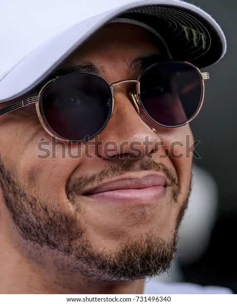 SEPANG, MALAYSIA : OCTOBER 01, 2017 : Lewis\
Hamilton of Great Britain and Mercedes during autographs session\
before the Malaysia Formula One (F1) Grand Prix at Sepang\
International Circuit\
(SIC).