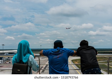 Sepang, Malaysia - September 23, 2018:  People Stand Watching Plane Taking Off At Kuala Lumpur International Airport 2