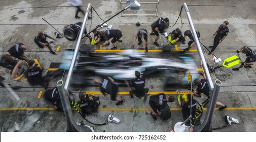 SEPANG, MALAYSIA - SEPTEMBER 28, 2017 : Team members of Mercedes driver Lewis Hamilton practice a pit stop ahead of the Malaysia Formula One (F1) Grand Prix at Sepang International Circuit (SIC).