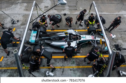SEPANG, MALAYSIA - SEPTEMBER 28, 2017 : Team members of Mercedes British driver Lewis Hamilton practice a pit stop ahead of the Malaysia Formula One (F1) Grand Prix at Sepang International Circuit.).