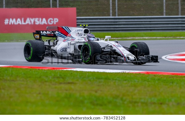SEPANG, MALAYSIA - SEPTEMBER 29, 2017 : Lance\
Stroll of Canada driving the (18) Williams Martini Racing on track\
during the Malaysia Formula One (F1) Grand Prix at Sepang\
International Circuit.