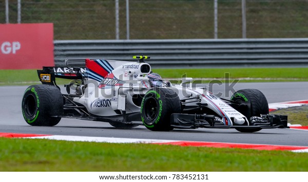 SEPANG, MALAYSIA - SEPTEMBER 29, 2017 : Lance
Stroll of Canada driving the (18) Williams Martini Racing on track
during the Malaysia Formula One (F1) Grand Prix at Sepang
International Circuit.