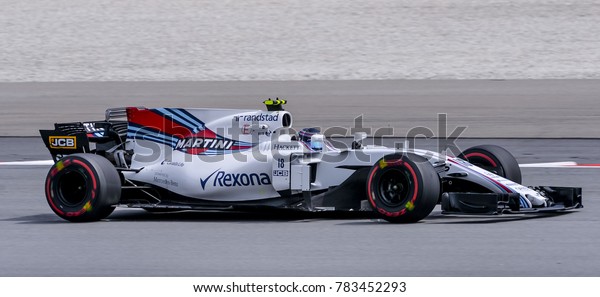 SEPANG, MALAYSIA - SEPTEMBER 29, 2017 : Lance\
Stroll of Canada driving the (18) Williams Martini Racing on track\
during the Malaysia Formula One (F1) Grand Prix at Sepang\
International Circuit.