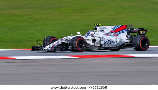 SEPANG, MALAYSIA - SEPTEMBER 30, 2017 : Lance\
Stroll of Canada driving the (18) Williams Martini Racing on track\
during the Malaysia Formula One (F1) Grand Prix at Sepang\
International Circuit.