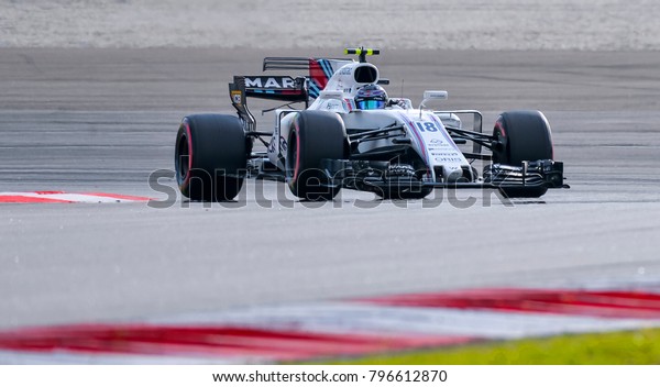 SEPANG, MALAYSIA - SEPTEMBER 30, 2017 : Lance\
Stroll of Canada driving the (18) Williams Martini Racing on track\
during the Malaysia Formula One (F1) Grand Prix at Sepang\
International Circuit.