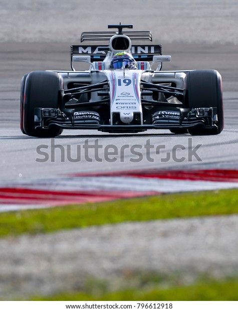 SEPANG, MALAYSIA - SEPTEMBER 30, 2017 : Felipe\
Massa of Brazil driving the (19) Williams Martini Racing on track\
during the Malaysia Formula One (F1) Grand Prix at Sepang\
International Circuit.