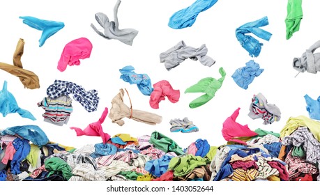 Separate Clothing Falling At The Big Pile Of Clothes On A White Background